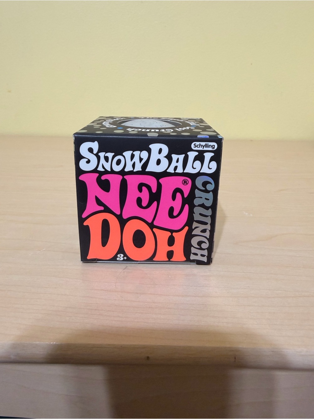 SnowBall NeeDoh Crunch Stress Toy - Black with Pink & Orange Accents
